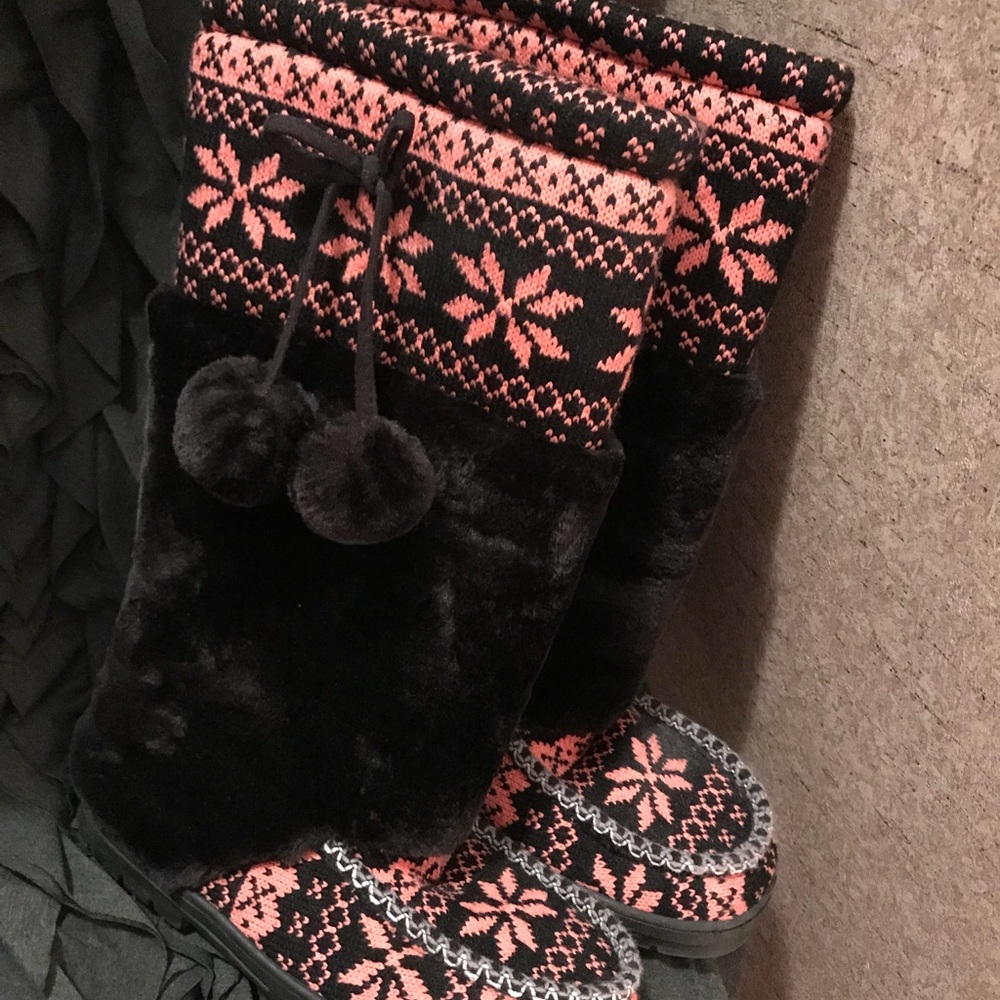 Pink and white winter boots.